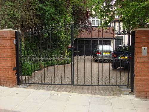 Secure driveway gates with both intercom system and multi user remote control to gain access.