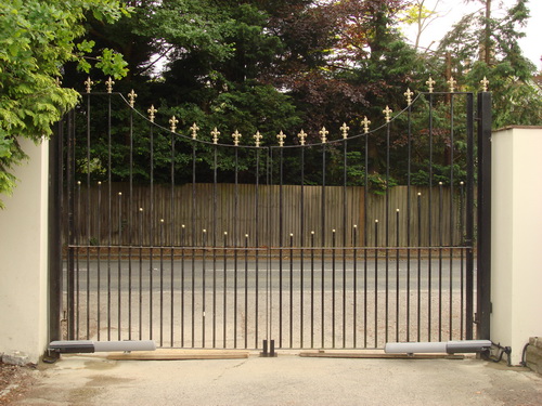 Another pair of wrought iron electric driveway gates, operated via remote control.