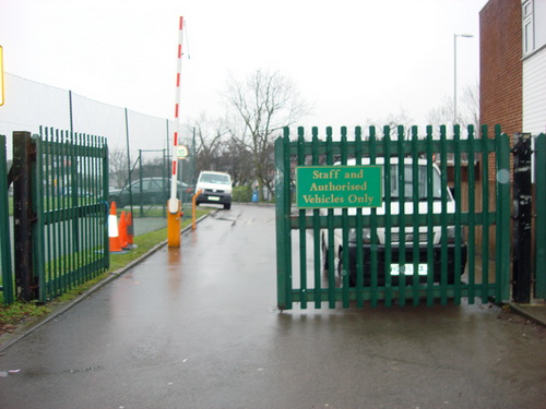 Green painted palisade double gates